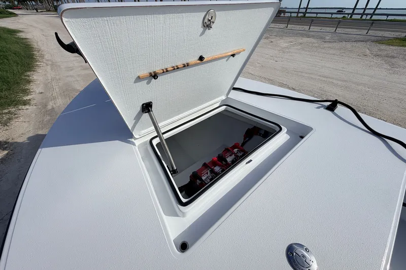 Slide: The Image of 2021 Hell's Bay Marathon boat hatch open, revealing storage compartment. - 40