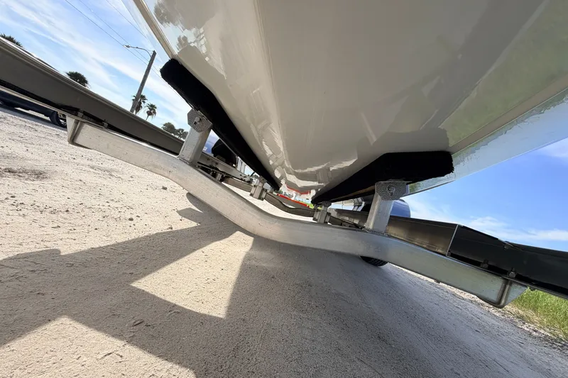 Slide: The Image of Underneath view of a 2021 Hell's Bay Marathon boat on a trailer. - 14