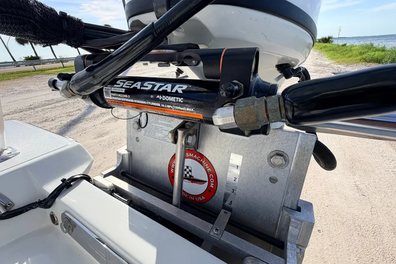 Slide: The Image of Close-up of 2021 Hell's Bay Marathon boat steering mechanism with SeaStar hydraulic system. - 78