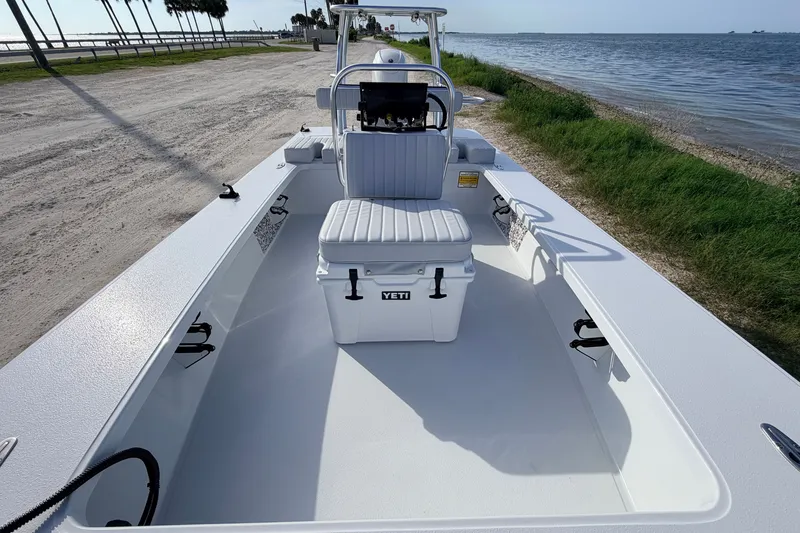 Slide: The Image of 2021 Hell's Bay Marathon boat with Yeti cooler, parked by the waterfront. - 53