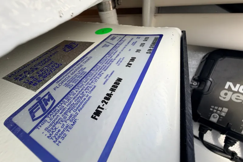 Slide: The Image of Label on Hell's Bay Marathon 2021 boat, showing specifications and manufacturer details. - 47