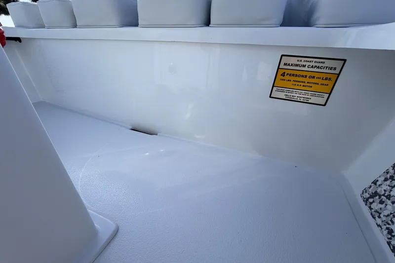 Slide: The Image of 2021 Hell's Bay Marathon boat interior with capacity label for four people. - 65