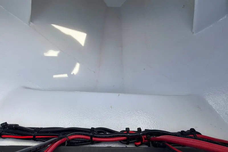 Slide: The Image of Interior view of a 2021 Hell's Bay Marathon boat with visible wiring. - 43