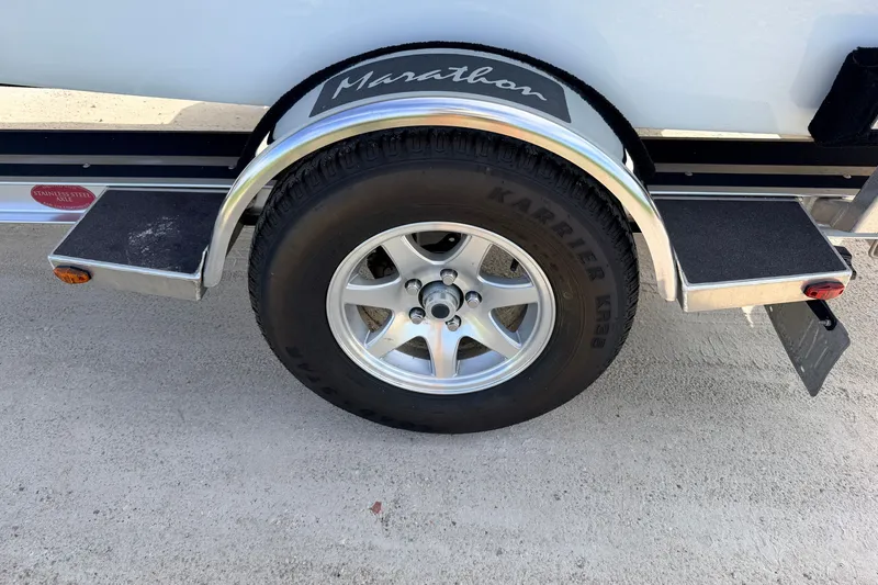 Slide: The Image of 2021 Hell's Bay Marathon trailer wheel with Karrier tire on sandy ground. - 18