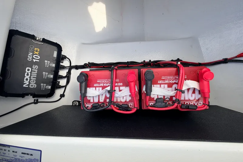 Slide: The Image of NOCO Genius 10X3 charger and Dakota Lithium batteries in 2021 Hell's Bay Marathon boat. - 44