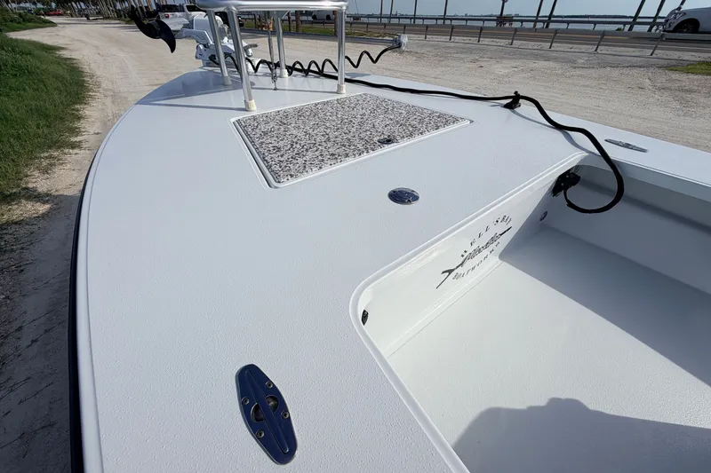 Slide: The Image of 2021 Hell's Bay Marathon boat deck with storage compartment and trolling motor. - 33
