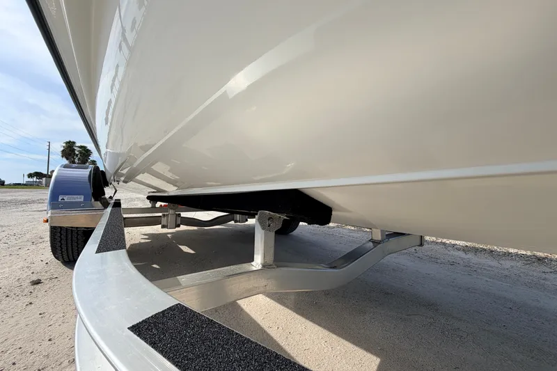 Slide: The Image of 2021 Hell's Bay Marathon boat on trailer, showcasing hull and trailer details. - 9