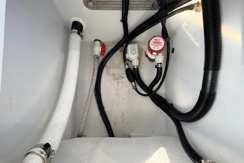 Slide: The Image of 2021 Hell's Bay Marathon boat interior wiring and plumbing components. - 76