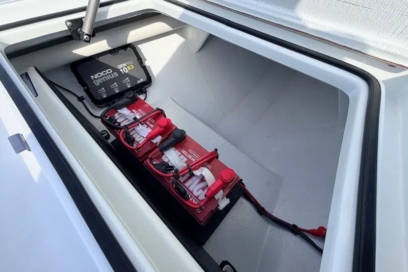 Slide: The Image of Battery compartment of 2021 Hell's Bay Marathon boat with NOCO Genius charger. - 42
