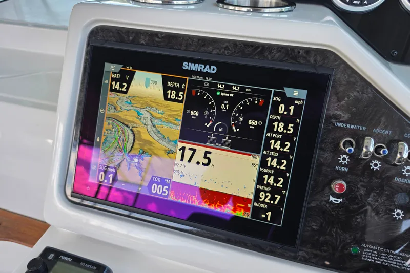 Slide: The Image of Simrad navigation display on 2021 Sea Ray Sundancer 350 boat dashboard. - 25