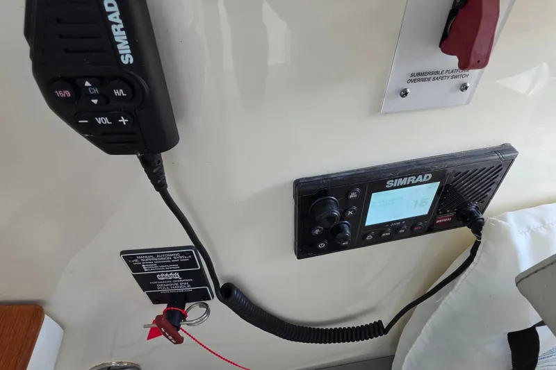 Slide: The Image of Simrad marine radio system on 2021 Sea Ray Sundancer 350 boat dashboard. - 35