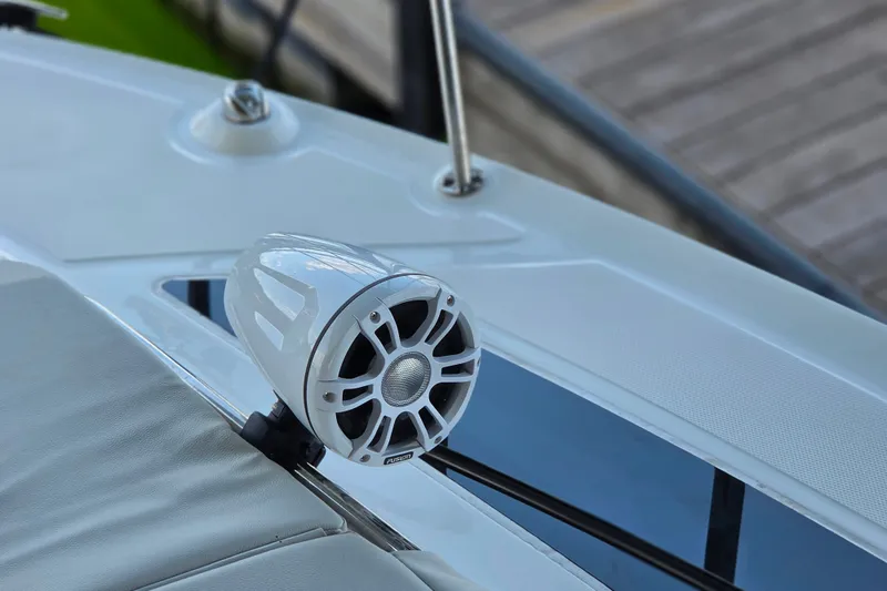 Slide: The Image of White speaker on 2021 Sea Ray Sundancer 350 boat deck, near dock. - 41