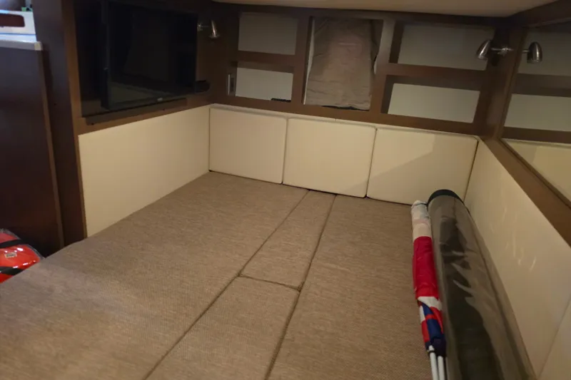 Slide: The Image of Interior cabin of 2021 Sea Ray Sundancer 350 with cozy seating and TV. - 53