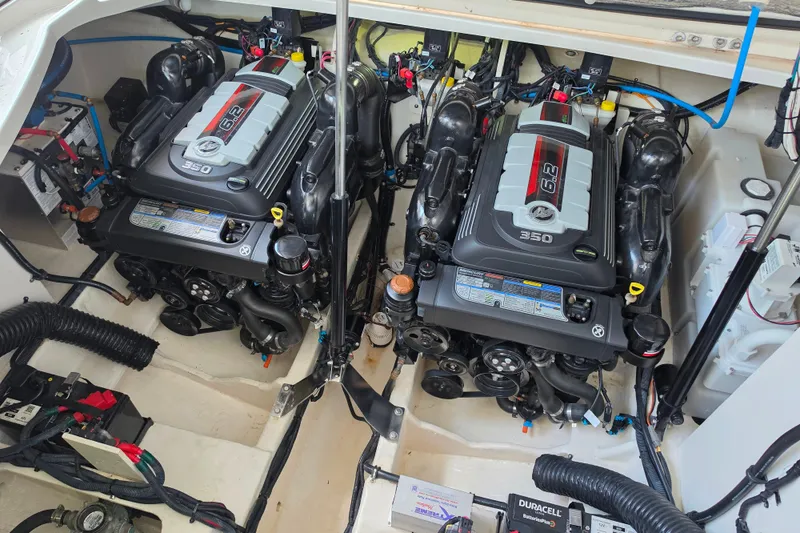 Slide: The Image of Engine compartment of a 2021 Sea Ray Sundancer 350 with dual 6.2L engines. - 55