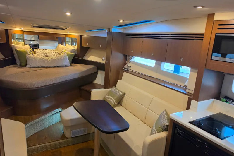 Slide: The Image of Luxurious interior of 2021 Sea Ray Sundancer 350 yacht with cozy seating and modern amenities. - 42