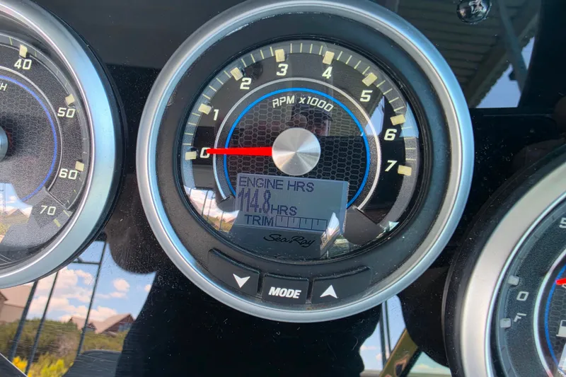Slide: The Image of Close-up of Sea Ray Sundancer 350 2021 dashboard showing engine hours and RPM gauge. - 61