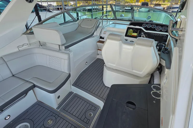Slide: The Image of 2021 Sea Ray Sundancer 350 cockpit with modern helm, seating, and sleek design. - 19