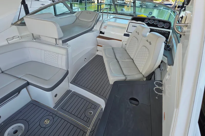 Slide: The Image of 2021 Sea Ray Sundancer 350 cockpit with luxurious seating and modern dashboard. - 39
