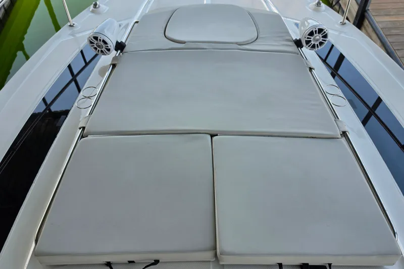 Slide: The Image of Sunpad on 2021 Sea Ray Sundancer 350 yacht, featuring speakers and cup holders. - 40