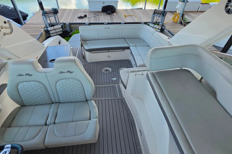 Slide: The Image of 2021 Sea Ray Sundancer 350 boat interior with luxurious seating and sleek design. - 36