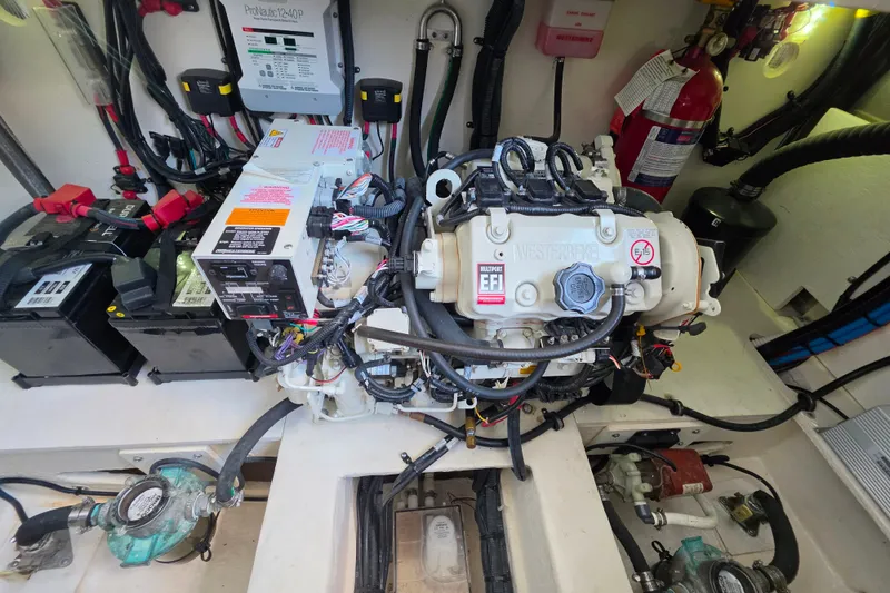 Slide: The Image of Engine room of 2021 Sea Ray Sundancer 350 with wiring and equipment. - 58