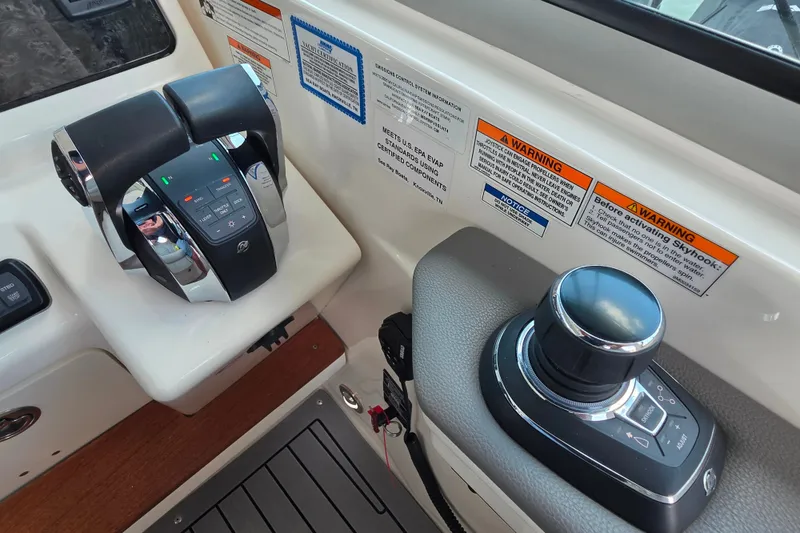 Slide: The Image of Control panel of 2021 Sea Ray Sundancer 350 boat with throttle and joystick. - 30