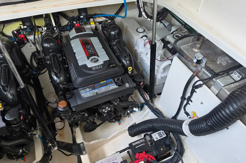 Slide: The Image of Engine compartment of 2021 Sea Ray Sundancer 350, featuring a powerful 6.2L engine. - 56
