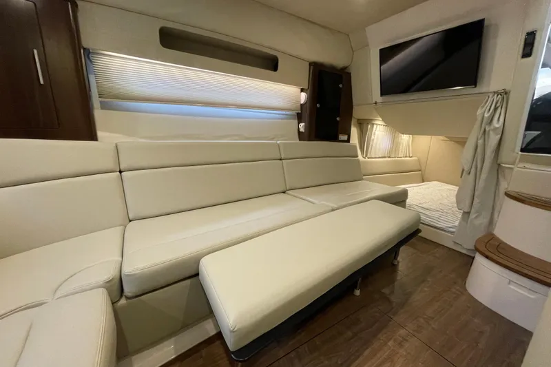 Slide: The Image of Interior of 2017 Regal 35 Sport Coupe with beige seating and modern amenities. - 32