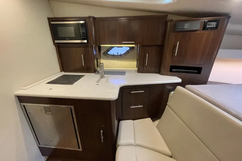 Slide: The Image of 2017 Regal 35 Sport Coupe interior kitchen with modern appliances and sleek cabinetry. - 29