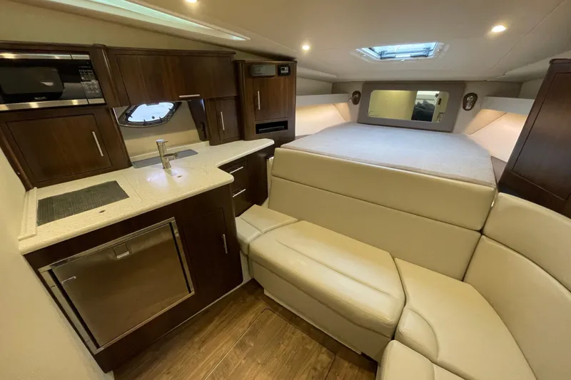 Slide: The Image of Luxurious interior of 2017 Regal 35 Sport Coupe with kitchenette and cozy seating area. - 28