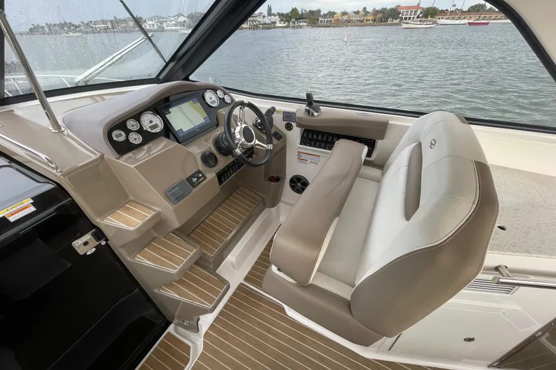Slide: The Image of 2017 Regal 35 Sport Coupe helm with modern controls and luxurious seating. - 24