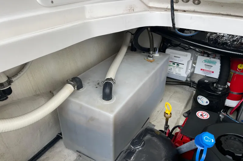 Slide: The Image of 2017 Regal 35 Sport Coupe engine compartment with hoses and equipment. - 39