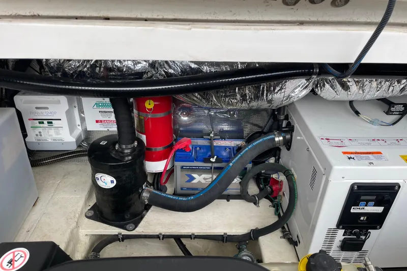 Slide: The Image of Engine compartment of a 2017 Regal 35 Sport Coupe with various components and wiring. - 38