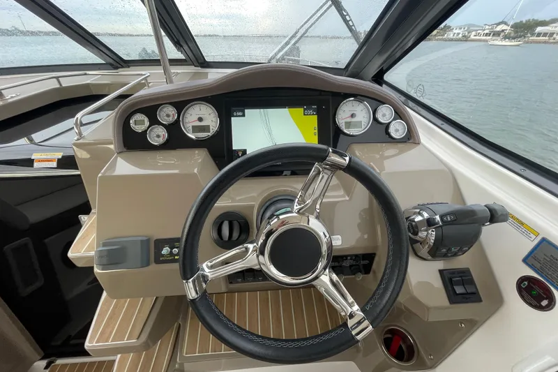 Slide: The Image of Steering console of 2017 Regal 35 Sport Coupe with modern controls and navigation display. - 25