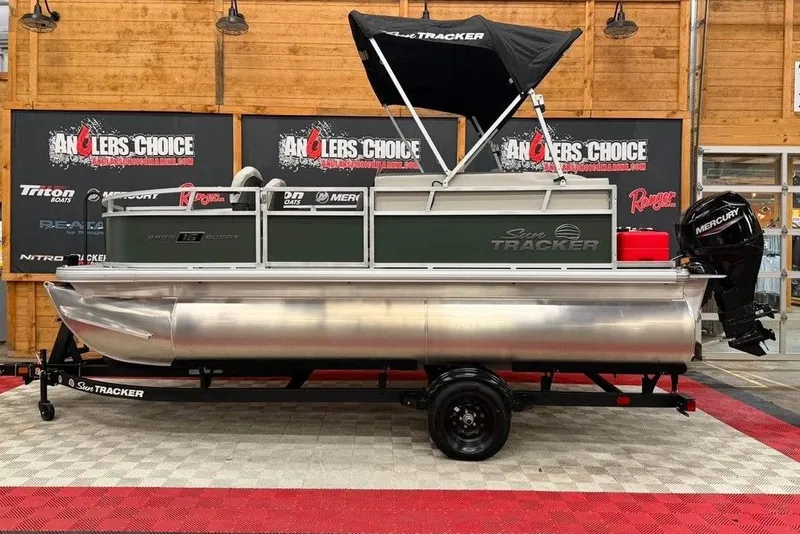 The Image of 2027 Sun Tracker Bass Buggy 16 XL Select pontoon boat on display indoors. - 1