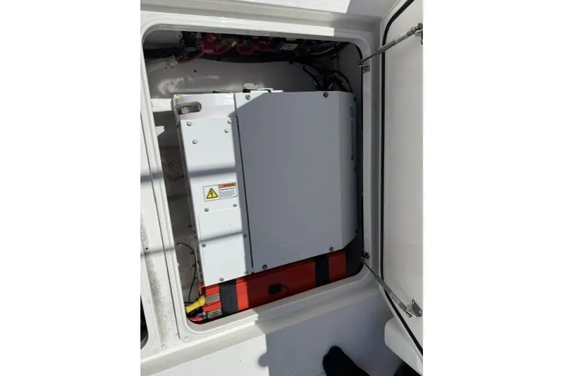 Slide: The Image of Electrical compartment of 2021 Valhalla Boatworks V-33, showcasing internal components and wiring. - 17