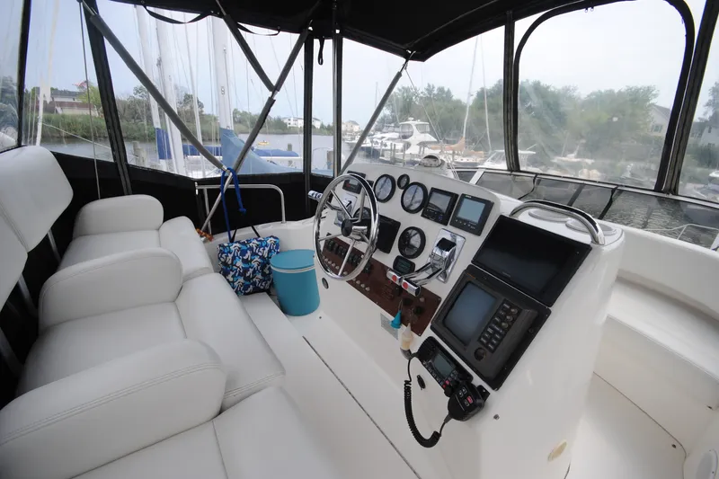 Slide: The Image of Interior of a 2000 Silverton 351 Sedan yacht cockpit with navigation instruments. - 8