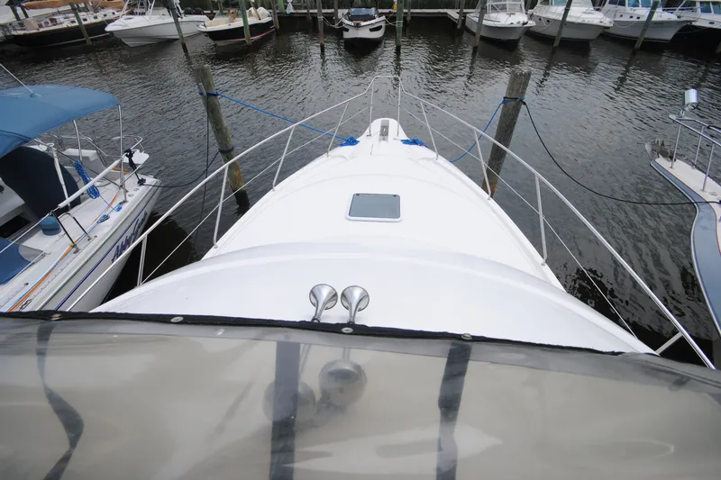 Slide: The Image of 2000 Silverton 351 Sedan yacht docked at marina, viewed from above. - 7