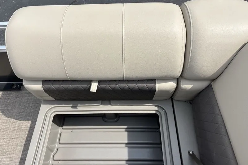 Slide: The Image of 2027 Sun Tracker Fishin' Barge 22 XP3 seat with storage compartment open. - 14