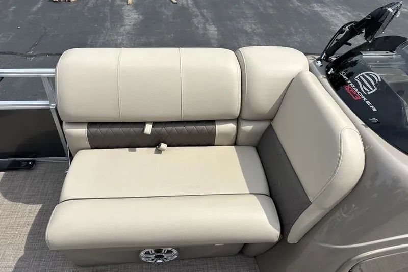Slide: The Image of 2027 Sun Tracker Fishin' Barge 22 XP3 boat seating, beige upholstery, and sleek design. - 13