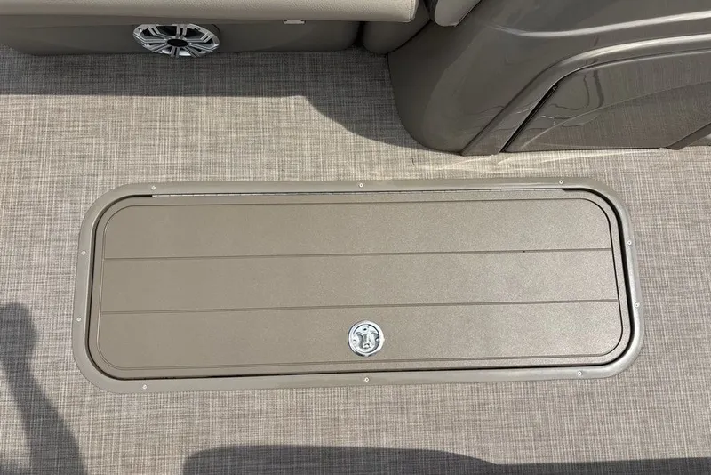 Slide: The Image of Storage compartment on 2027 Sun Tracker Fishin' Barge 22 XP3 boat deck. - 19