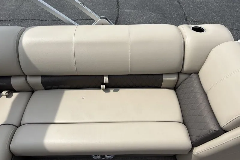 Slide: The Image of 2027 Sun Tracker Fishin' Barge 22 XP3 beige seating with cup holder and quilted accents. - 25