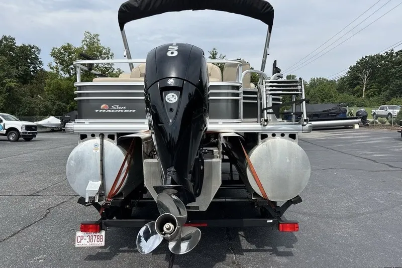 Slide: The Image of 2027 Sun Tracker Fishin' Barge 22 XP3 pontoon boat with powerful outboard motor. - 21