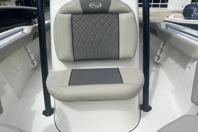 Slide: The Image of 2026 Key West 219 FS boat interior with cushioned seating and sleek design. - 5
