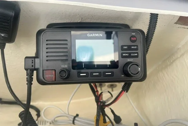 Slide: The Image of Garmin marine radio installed on a 2026 Key West 219 FS boat. - 11