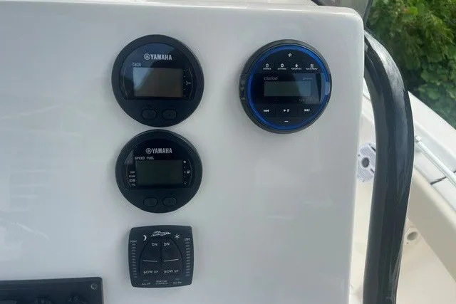 Slide: The Image of Control panel of 2026 Key West 219 FS boat with Yamaha gauges and audio system. - 10