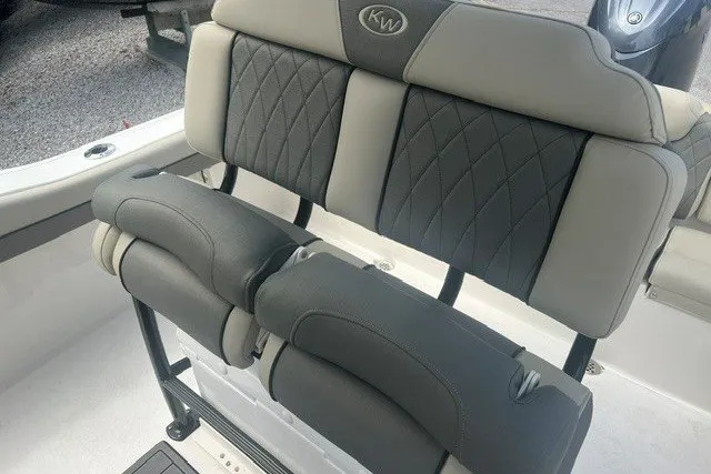 Slide: The Image of 2026 Key West 219 FS boat seating with elegant gray upholstery and diamond stitching. - 9