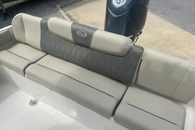 Slide: The Image of 2026 Key West 219 FS boat seating with gray upholstery and KW logo. - 7