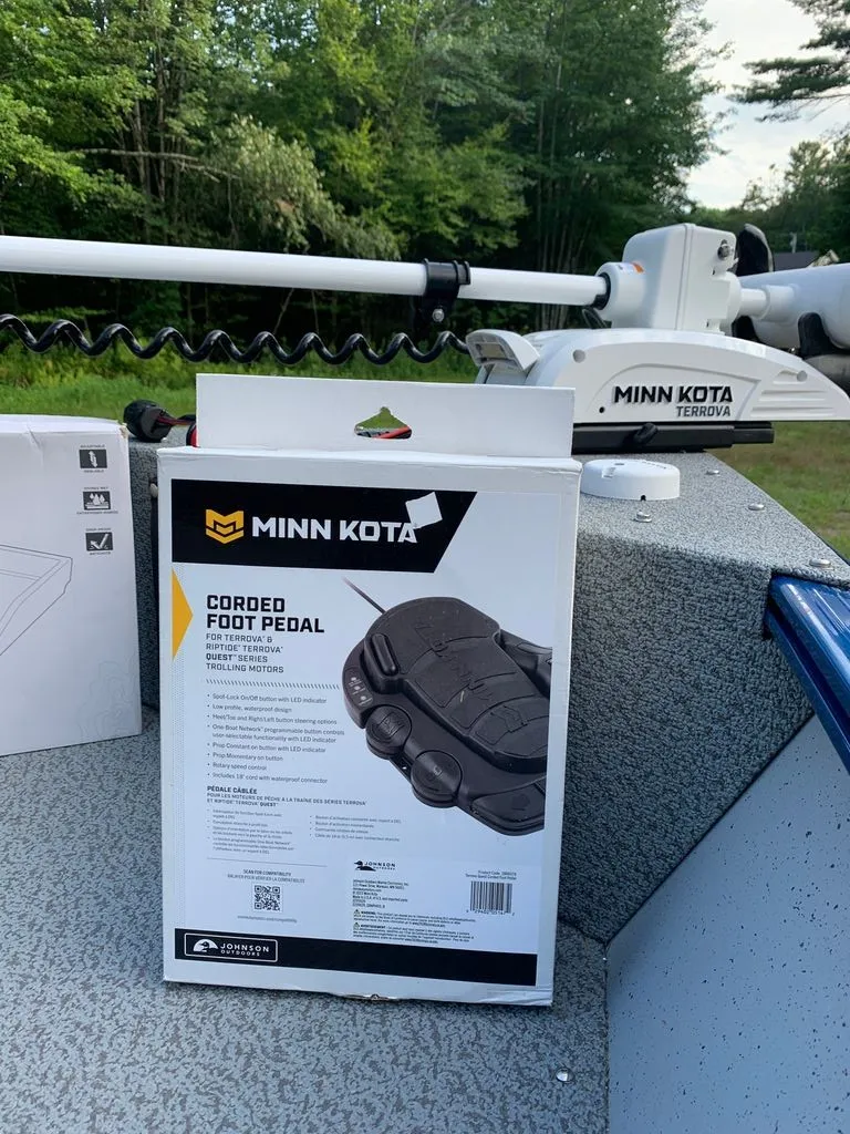 Slide: The Image of A Minn Kota foot pedal on a boat with a Minn Kota trolling motor in the background. - 6
