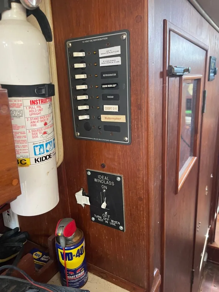 Slide: The Image of Interior view of a boat with a control panel, fire extinguisher, and WD-40 can. - 10